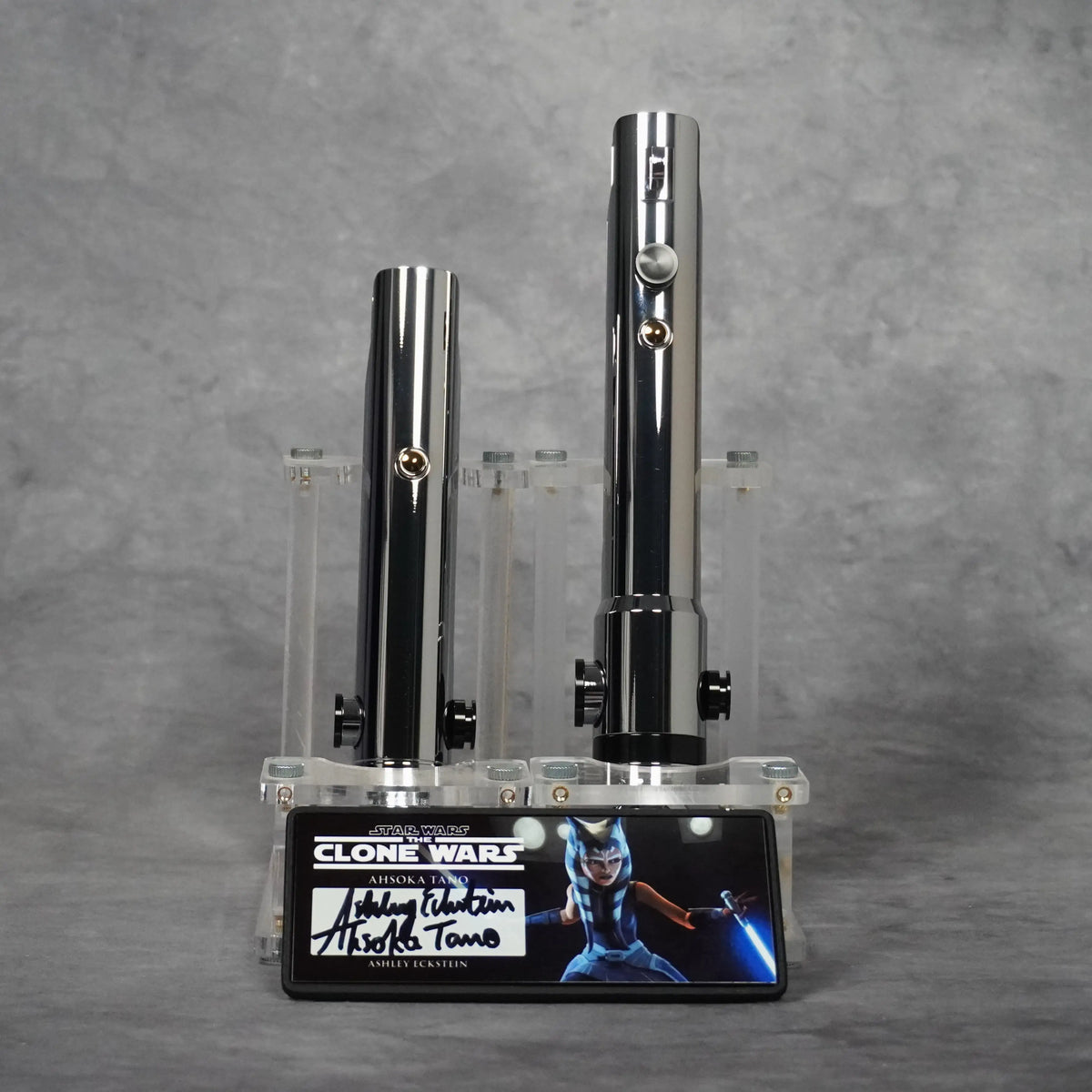 Signature Edition Ahsoka Tano Clone Wars lightsaber duo on an acrylic stand with the character plaque signed by Ashley Eckstein