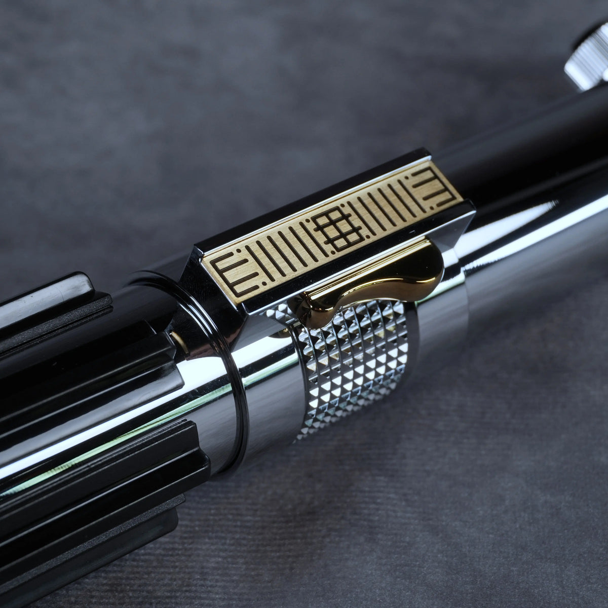 Gold-etched control section and chrome detail on the Anakin Skywalker Episode III lightsaber hilt