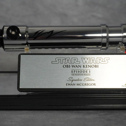 Ewan McGregor's black ink signature on the Obi-Wan Episode I hilt, above the brushed metal Signature Edition plaque