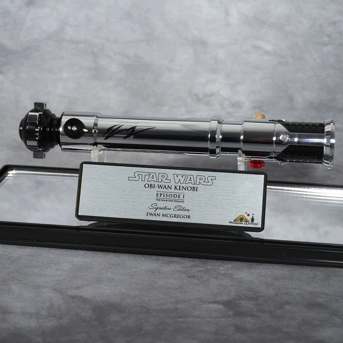 Signed Obi-Wan Kenobi Episode I lightsaber on stand with Signature Edition plaque