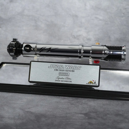 Signed Obi-Wan Kenobi Episode I lightsaber on stand with Signature Edition plaque