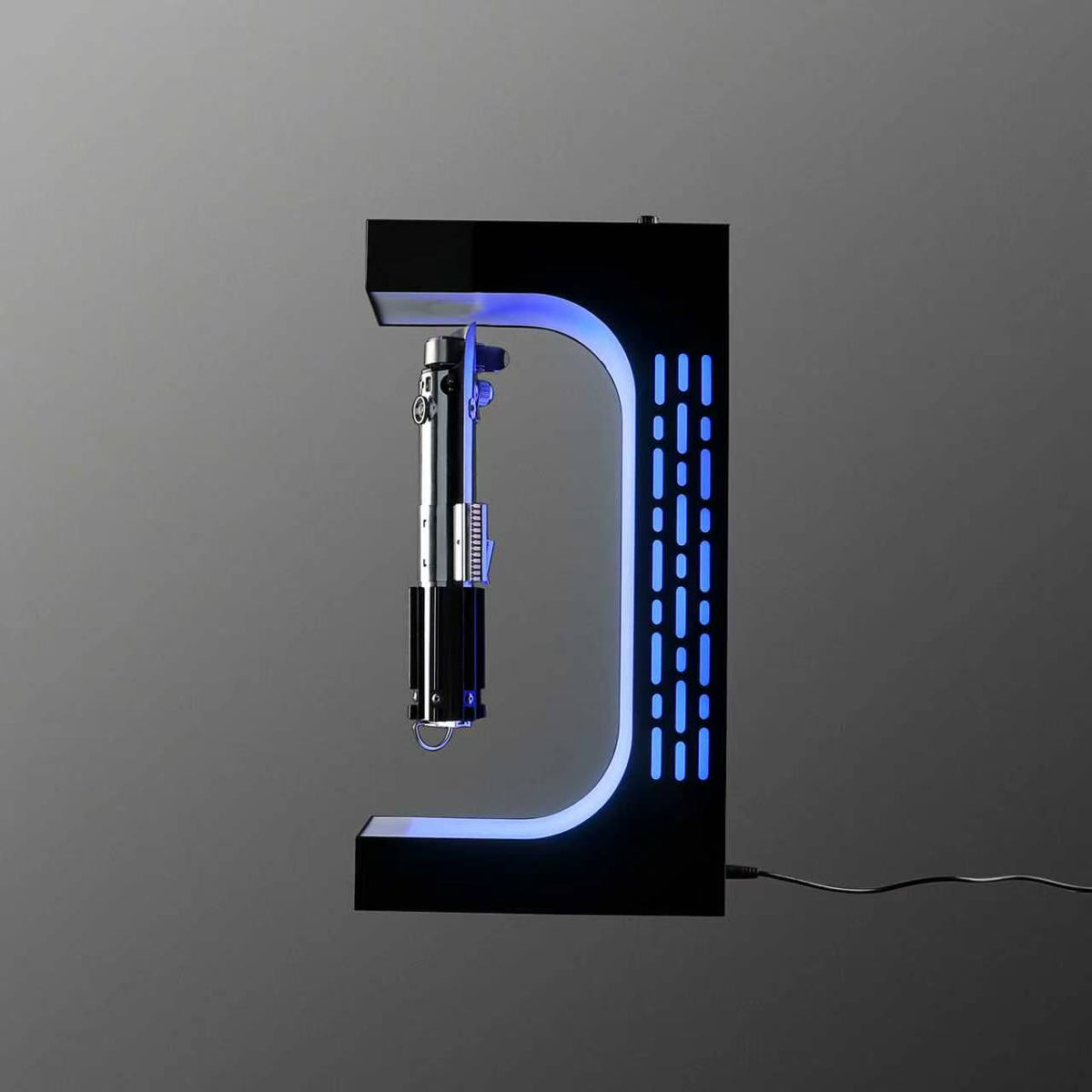 Floating lightsaber display stand holding a hilt by magnet, blue light