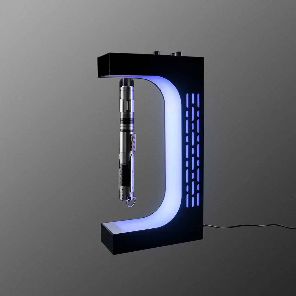 Lightsaber hilt floating above the base of the magnetic display stand