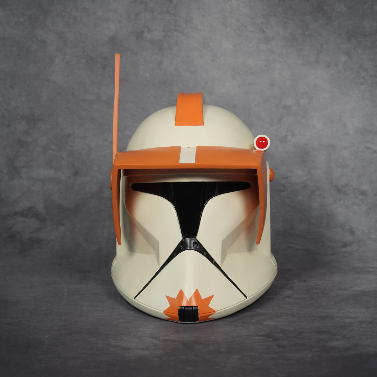 Commander Cody Phase I wearable helmet, front view with orange command visor, crest and antenna