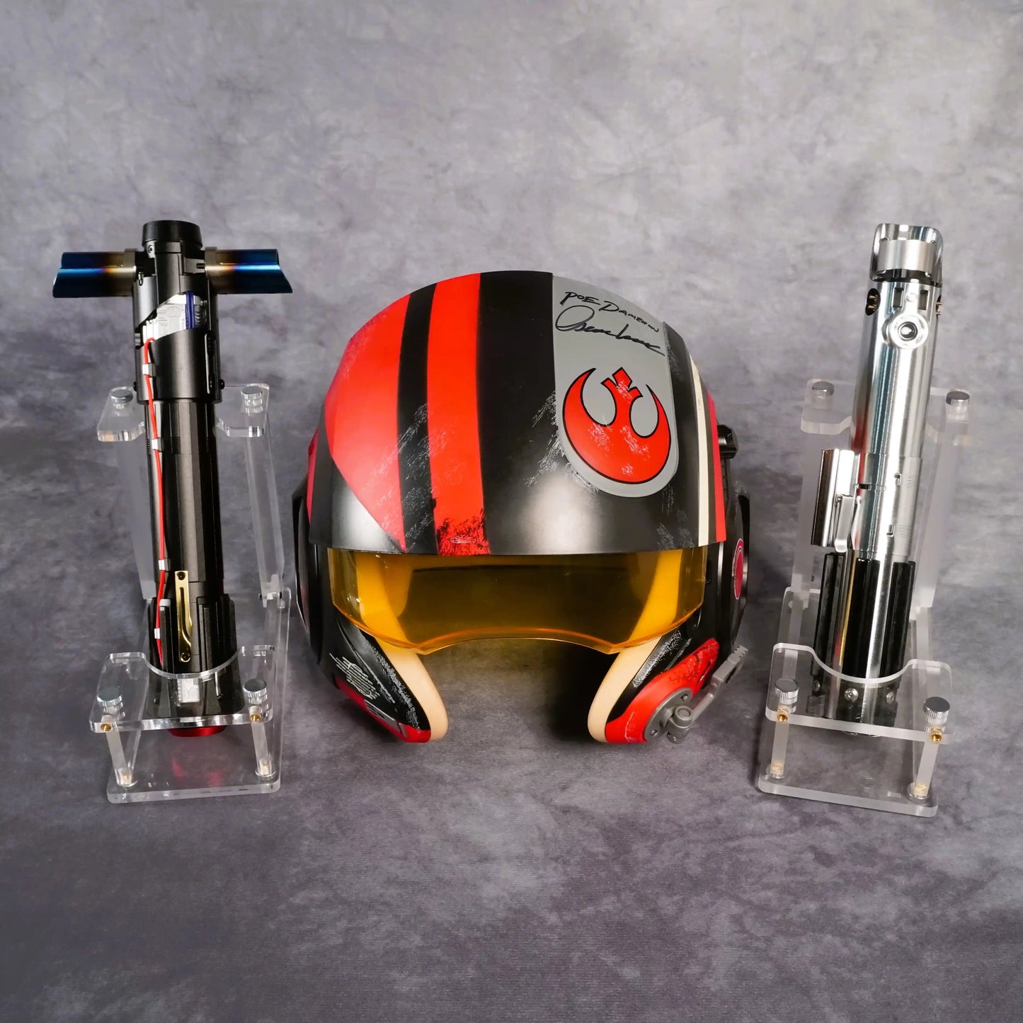 Raffle: The Force Awakens Bundle – Signed Poe Dameron Helmet + Rey & Kylo Sabers