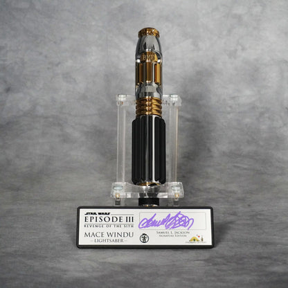 Signature Edition Mace Windu lightsaber upright on its stand with the BMF engraved emitter, above the brushed metal plaque signed by Samuel L. Jackson