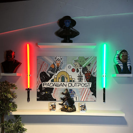 LED Sabel Display Lights on a wall with a "Padawaan Outpost" poster and other merchandising